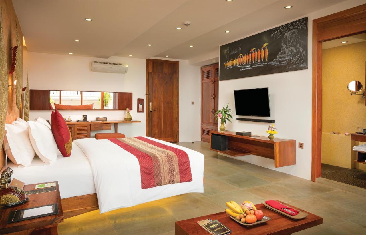 Golden Temple Residence Siem Reap Exteriér fotografie A bedroom at the resort